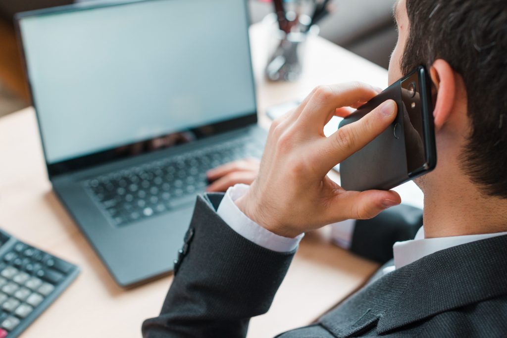 office desktop with laptop business man